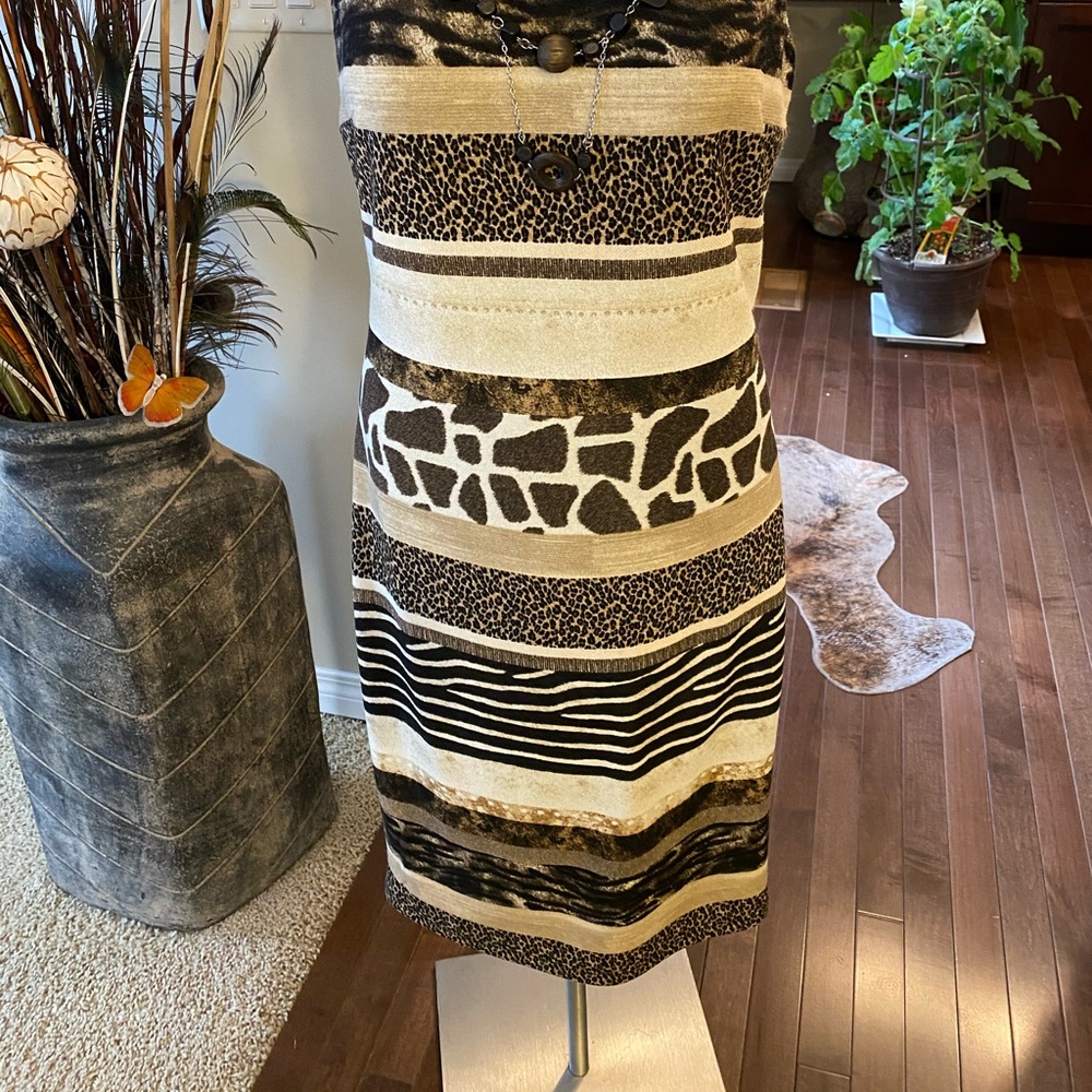 Women’s dress size 8 with beautiful animal print design. Brand new with tags.